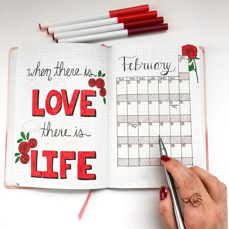 Bullet journal monthly calendar with red roses