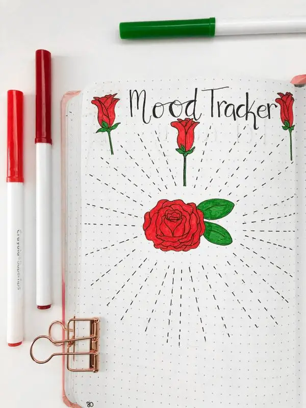 Bullet journal mood tracker with red roses