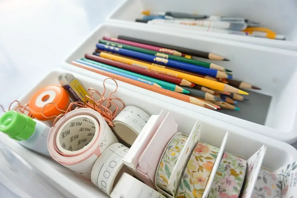 stationery and office supplies inside plastic organizers