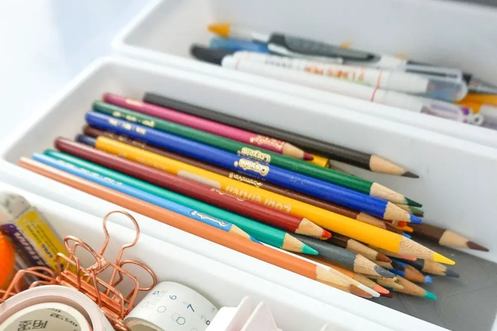 stationery and office supplies inside plastic organizers