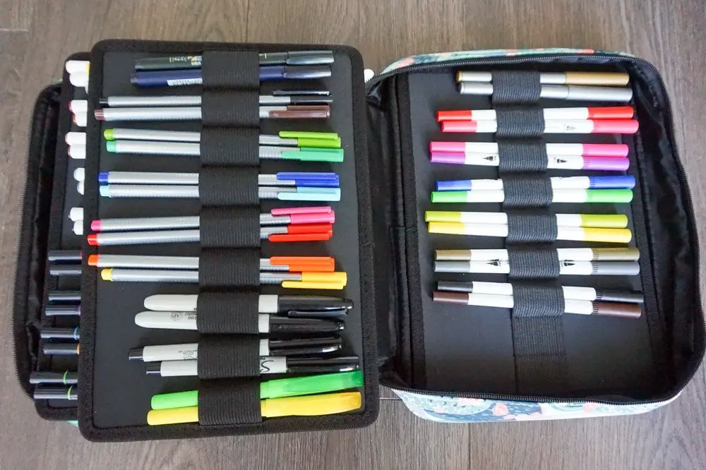 colored pens and brush pens inside pencil case