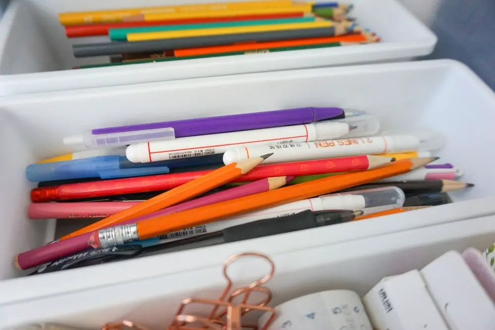 stationery and office supplies inside plastic organizers