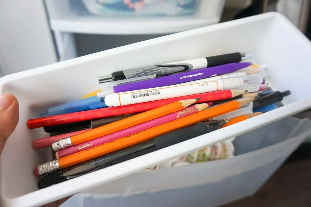 stationery and office supplies inside plastic organizers