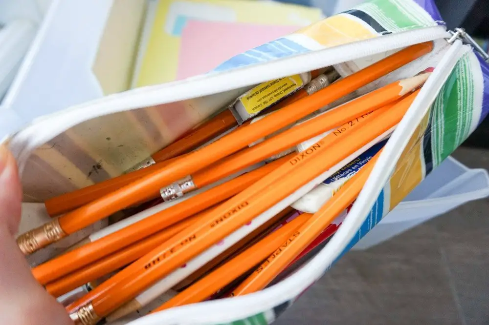 stationery and office supplies inside plastic organizers