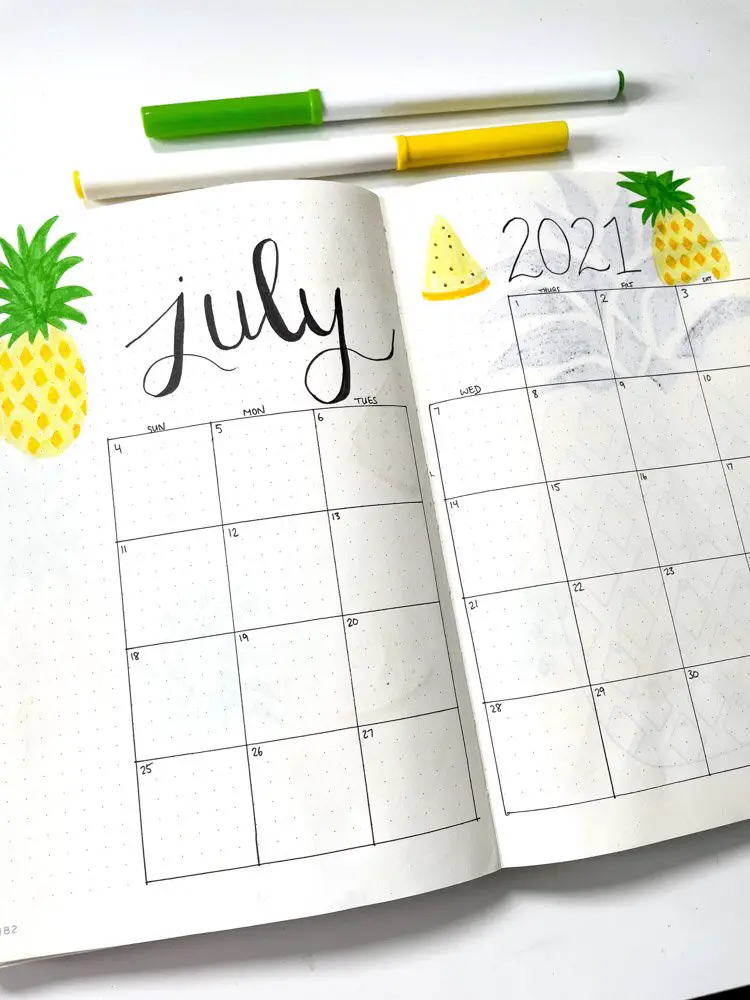 july bullet journal calendar with pineapples