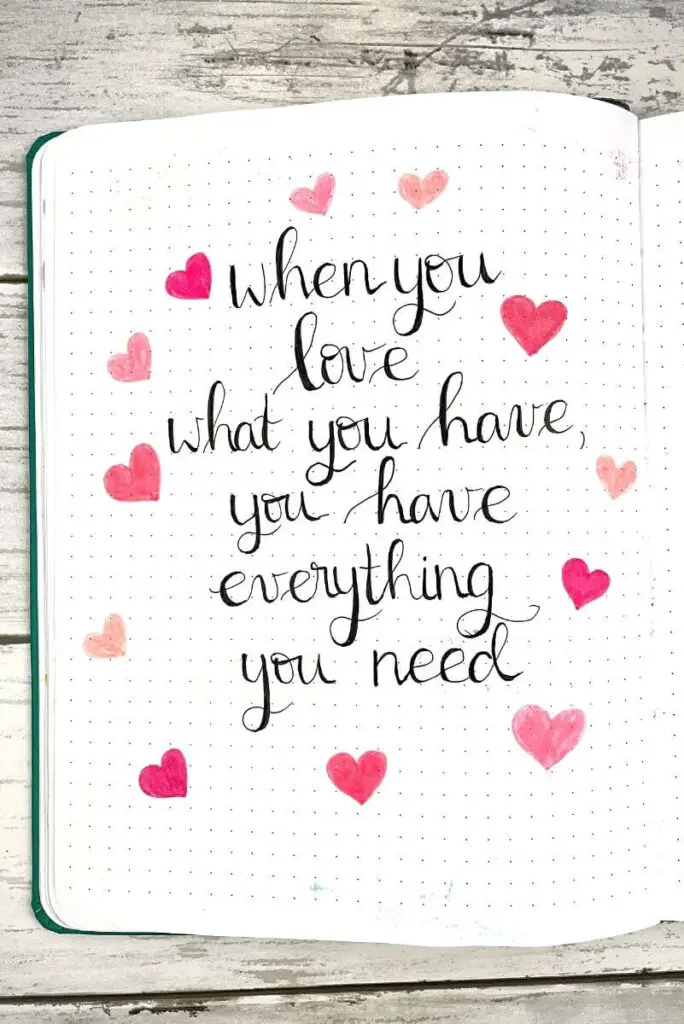 february bullet journal quote page: when you love what you have, you have everything you need
