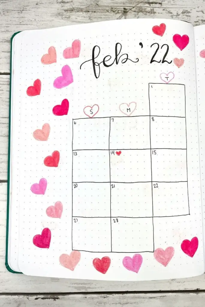 February bullet journal calendar filled with pink hearts