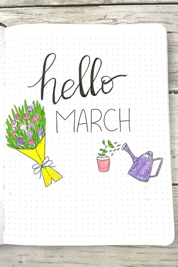 March bullet journal cover page: hello march with flowers on the sides