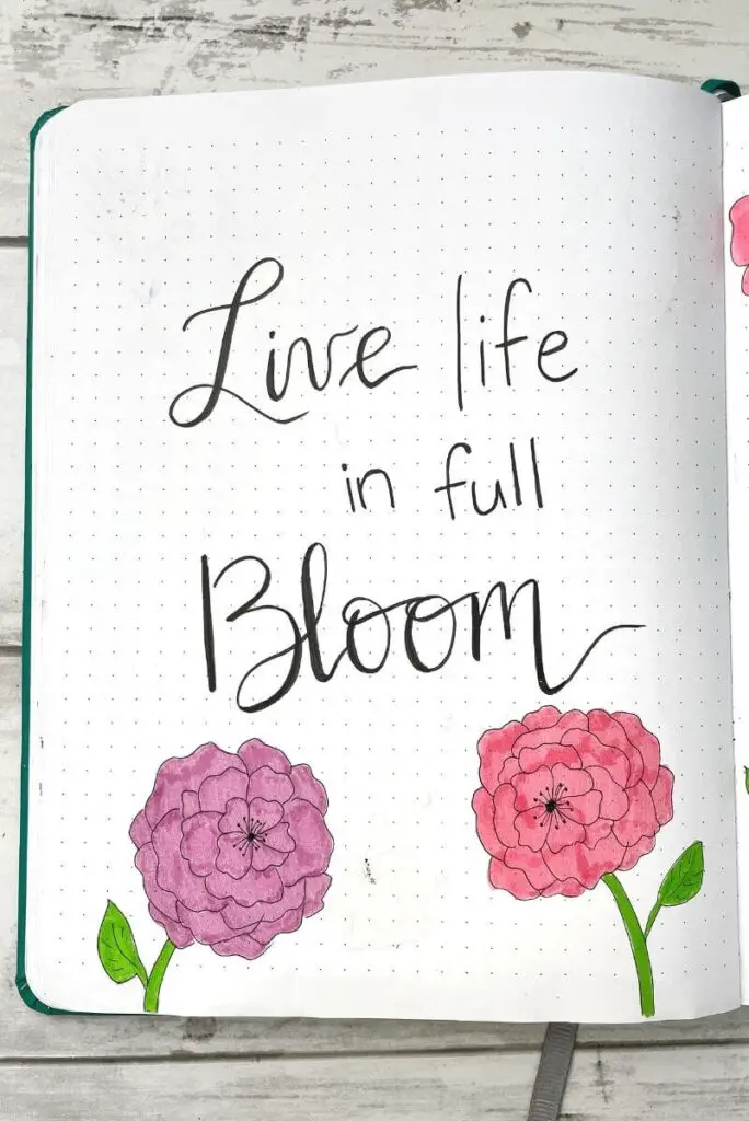April bullet journal quote page: live life in full bloom