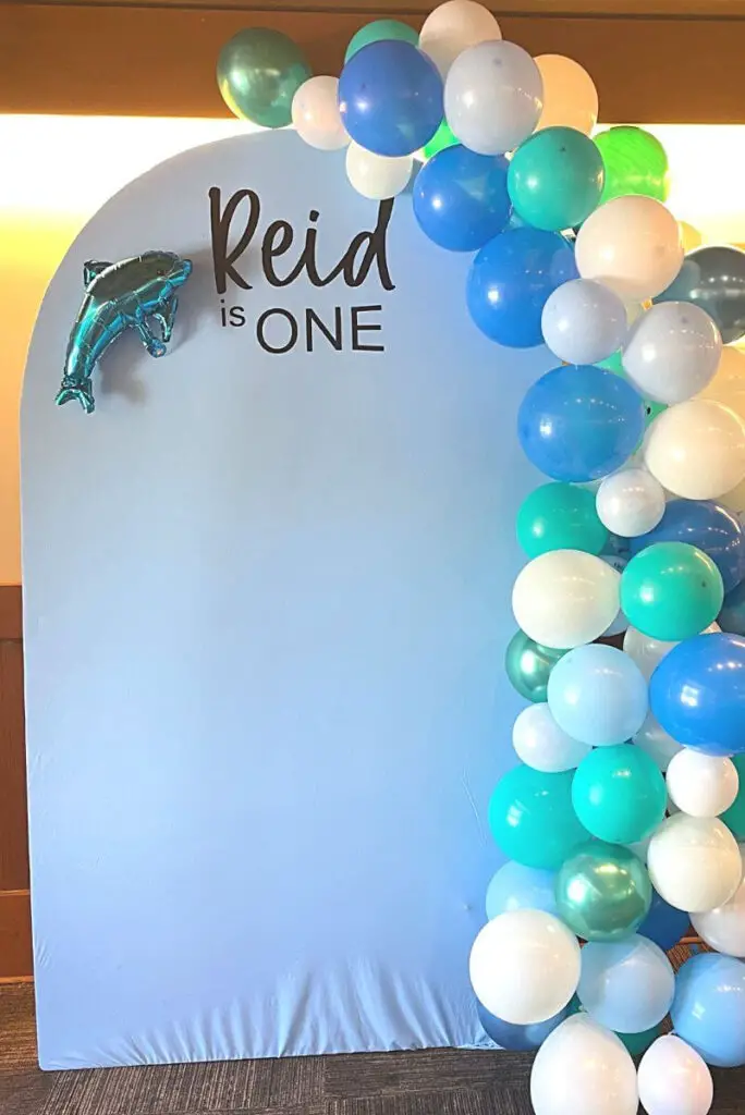 diy photo arch backrop for first birthday party with balloon garland